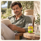 An adult enjoys a quiet moment on a terrace with Alfa gummies nearby