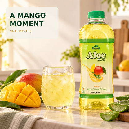 Mango Aloe Vera Drink bottle with a glass and fresh mango in a sunlit kitchen