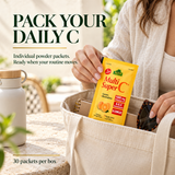Individual Alfa Multi Super C powder packet carried in a canvas tote for on-the-go mixing