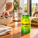 Alfa Vitamin D3 beside a breakfast bowl and water glass