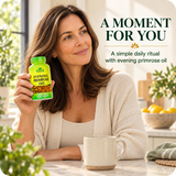 Woman holding Alfa Vitamins Evening Primrose Oil during a simple daily routine.