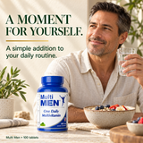 Adult man enjoying breakfast with Multi Men multivitamins and a glass of water.