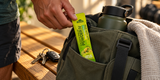 Small Alfa Powder IV sachet being packed in a gym bag