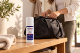 Closed Alflexil Roll-On bottle beside a bag on an entry bench.
