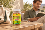 Closed Alfa Turmeric Ginger Gummies Adult bottle on a terrace table.