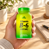 Vitamin B6 100 mg closed package held in an adult hand