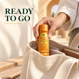 Vitamin C Shot being placed into a canvas bag — ready to go
