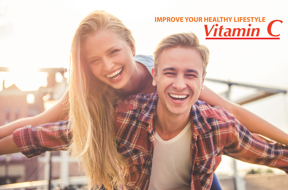 A joyful couple, with the woman leaning on the mans back, smiles brightly under a sunny sky. Text in the top right says Boost Your Immune System with Alfa Vitamins: Vitamin C 1000 mg Chewables - 60 tablets.