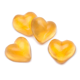 Four yellow-orange, translucent heart-shaped candies infused with fish collagen from Alfa Vitamins Store’s Collagen Gummies lie scattered on a white background.